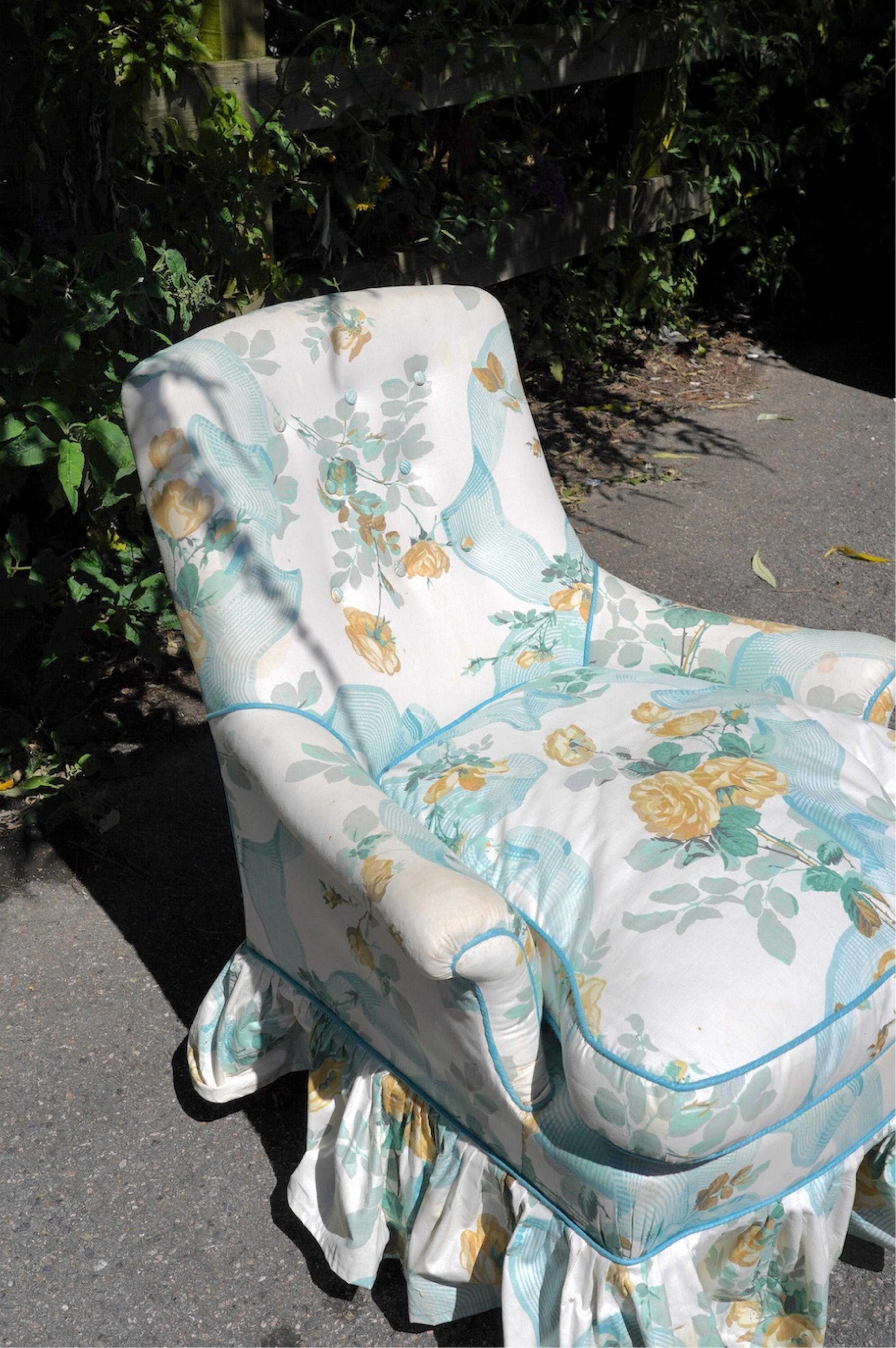 A Victorian small button back armchair with floral fabric upholstery, width 70cm, depth 60cm, height 80cm. Condition - fair